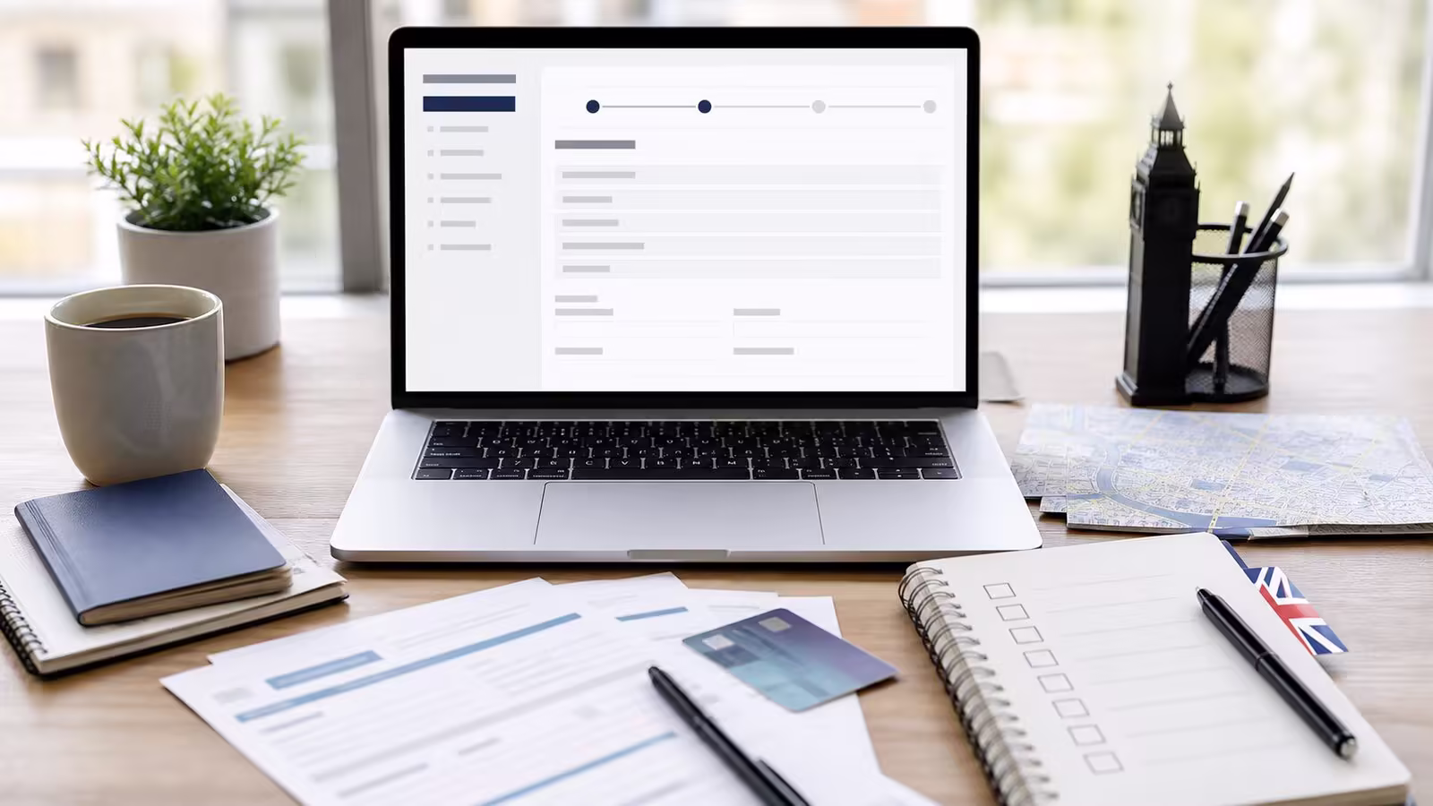 UK limited company registration field notes Documents and laptop for registering a UK limited company as a non-resident founder